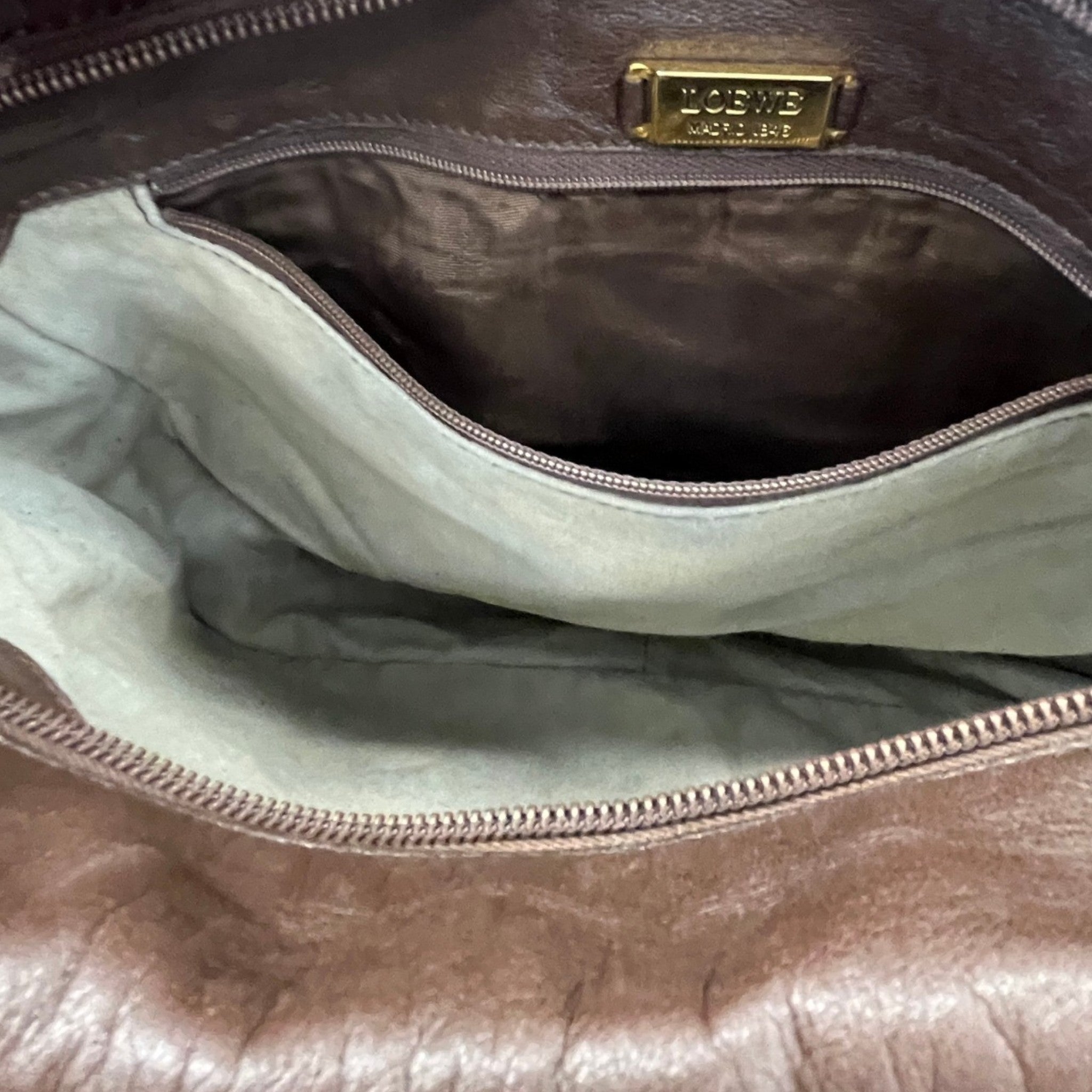 Women's Embossed Anagram Shoulder Bag Brown