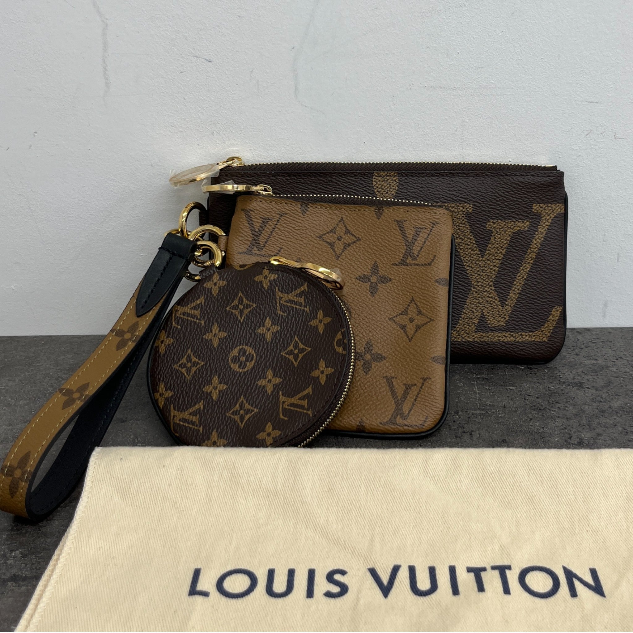 Women's Reverse Monogram Giant Trio Pouch Brown