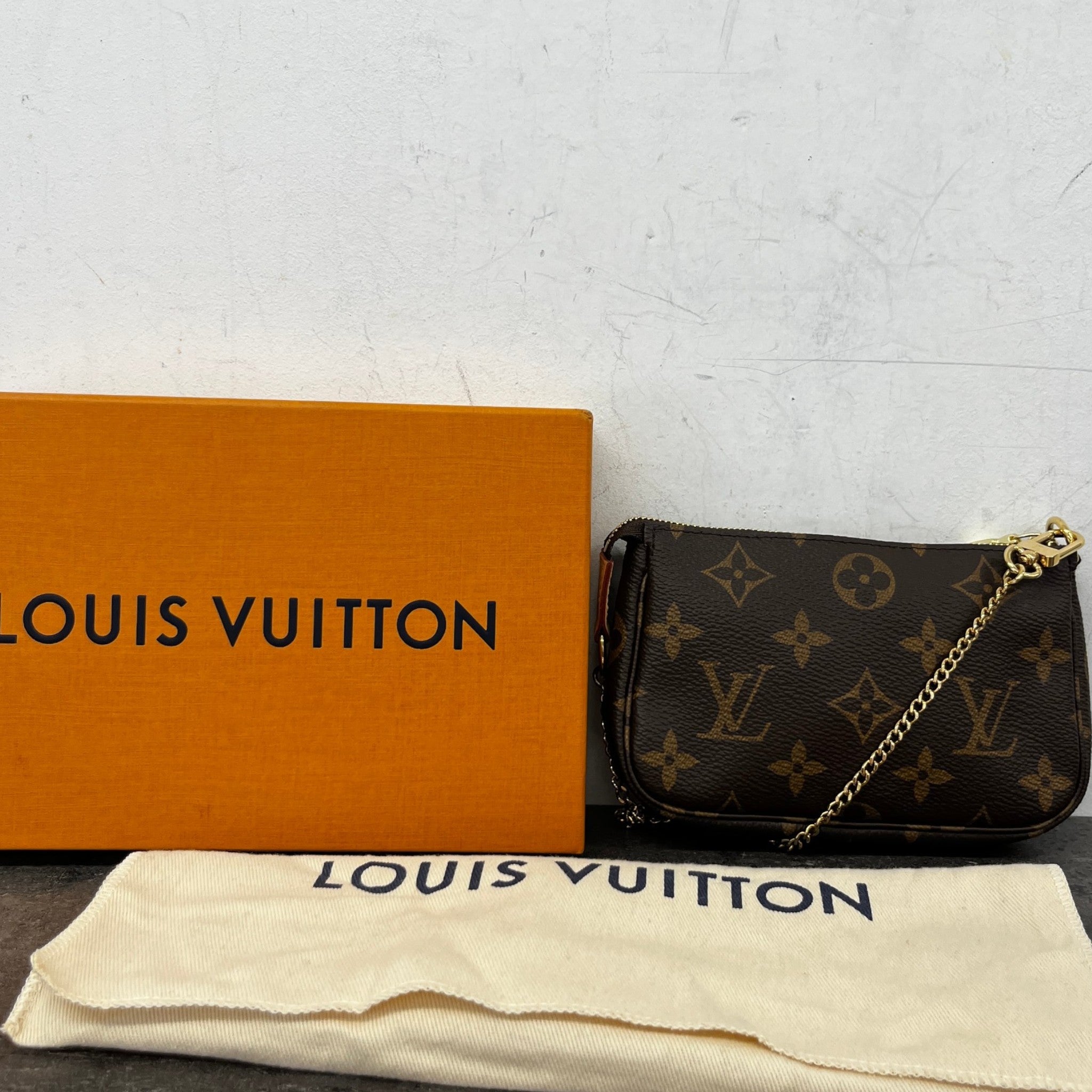 Women's Monogram Mini Pochette Accessoires Bag Brown