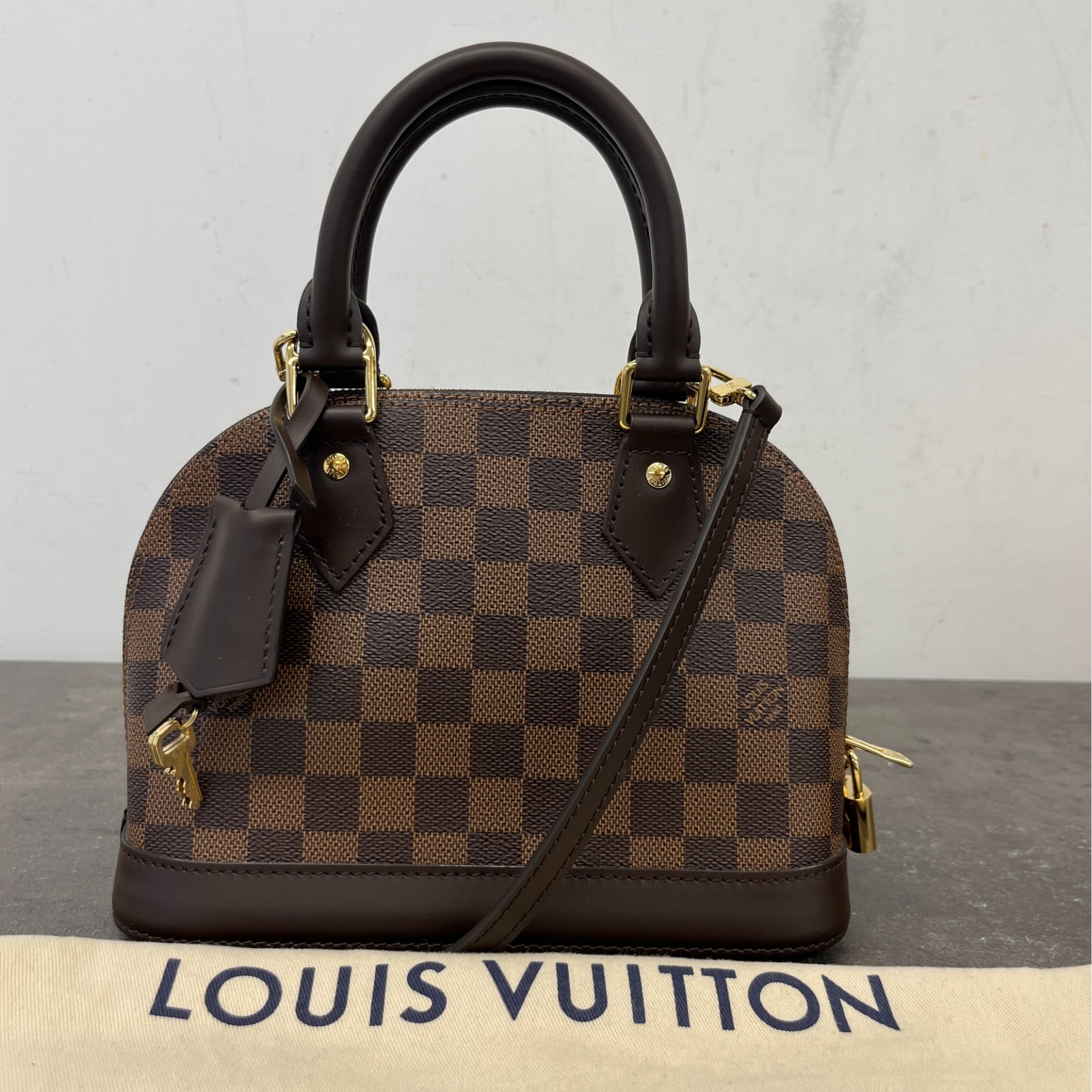 Men's Damier Ebene Alma Bb Bag Brown