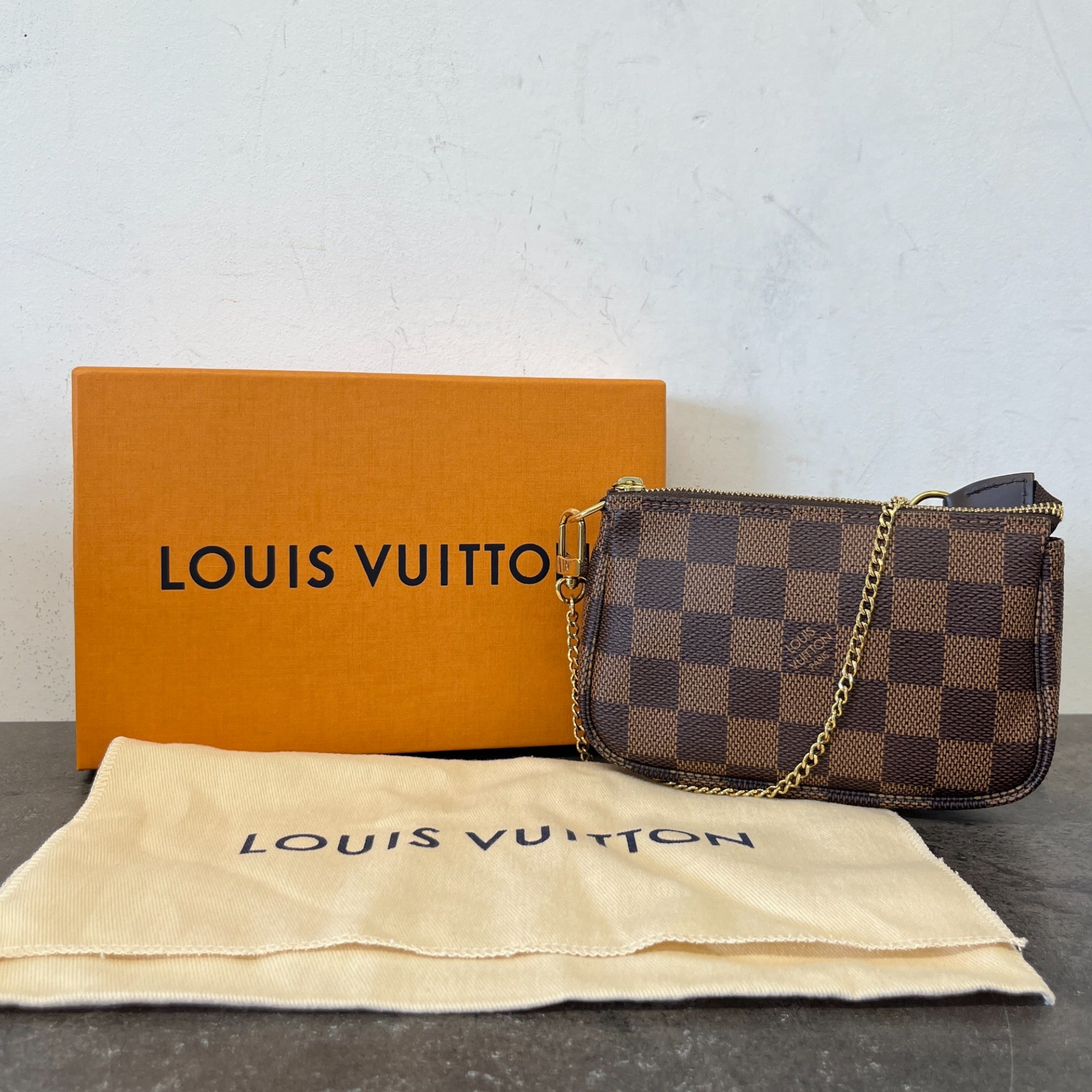 Women's Damier Ebene Mini Pochette Bag Brown