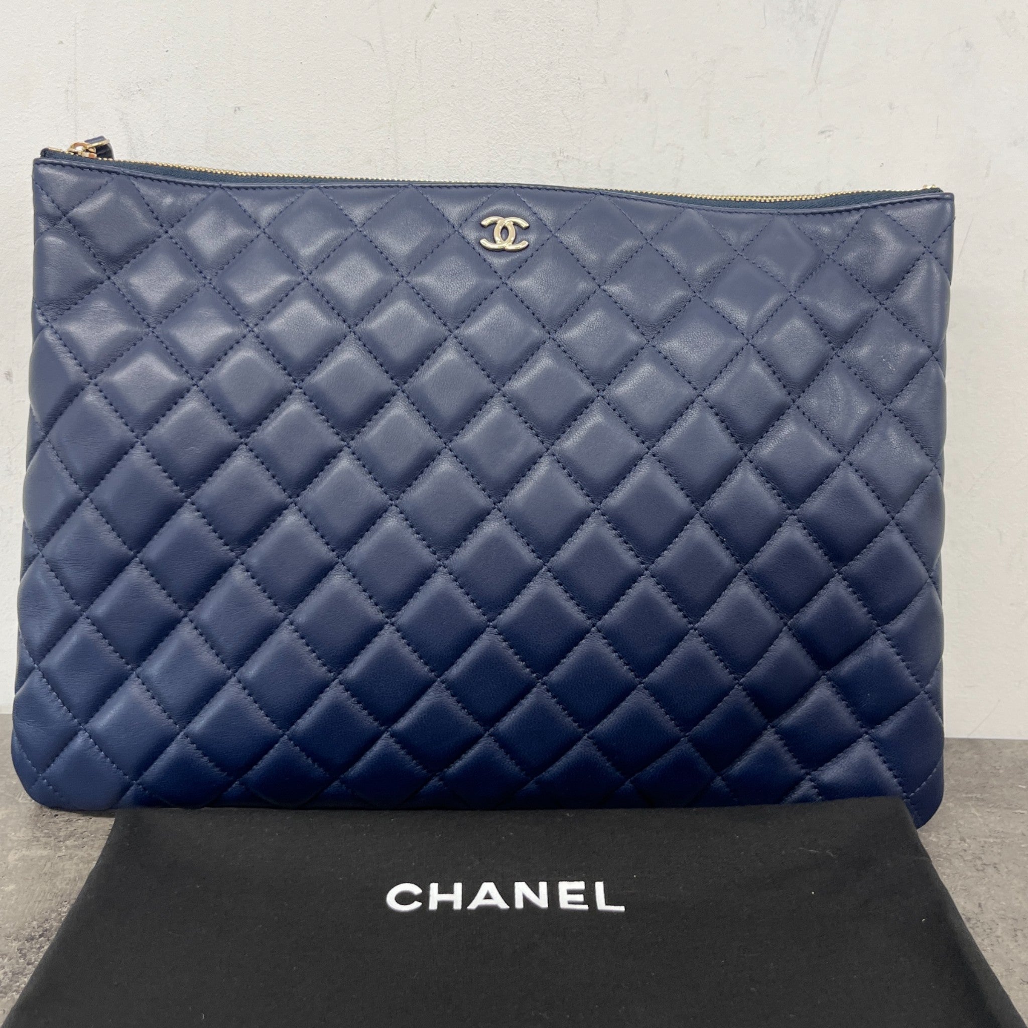 Women's Large Quilted Caviar O Case Clutch Navy