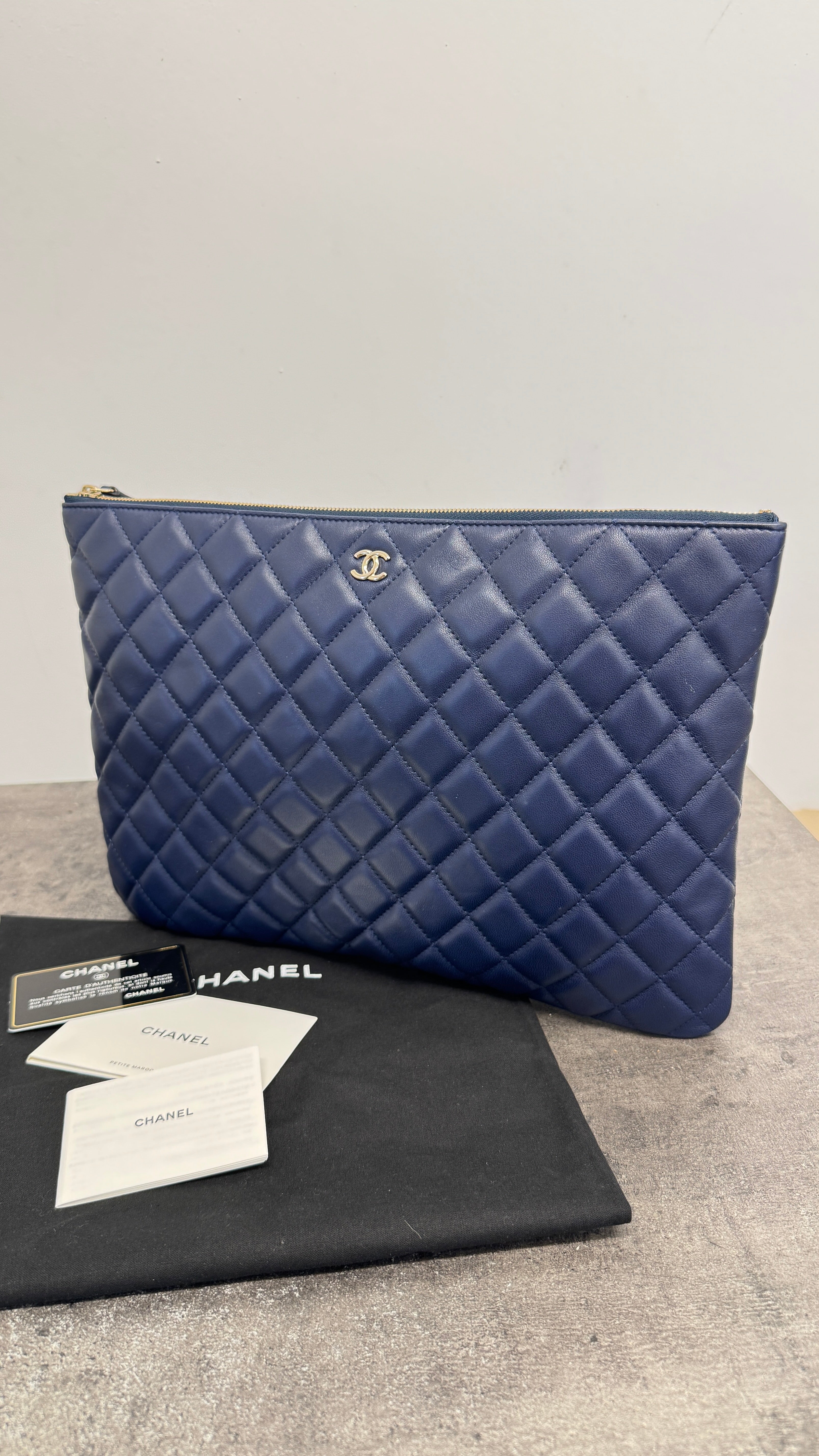 Women's Large Quilted Caviar O Case Clutch Navy