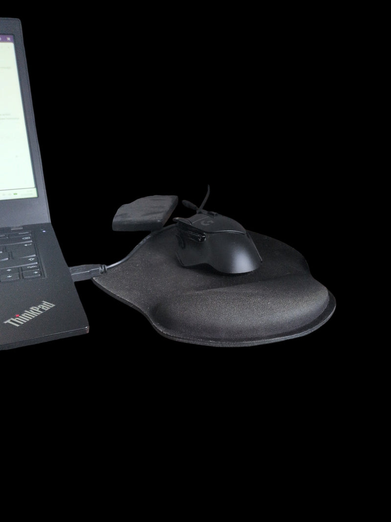 Label Source black ergonomic mouse pad with wrist support and wireless gaming mouse connected to a ThinkPad laptop